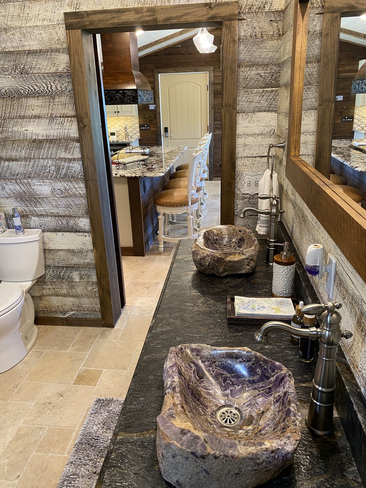 The suite bathroom, with its stone vessel sink