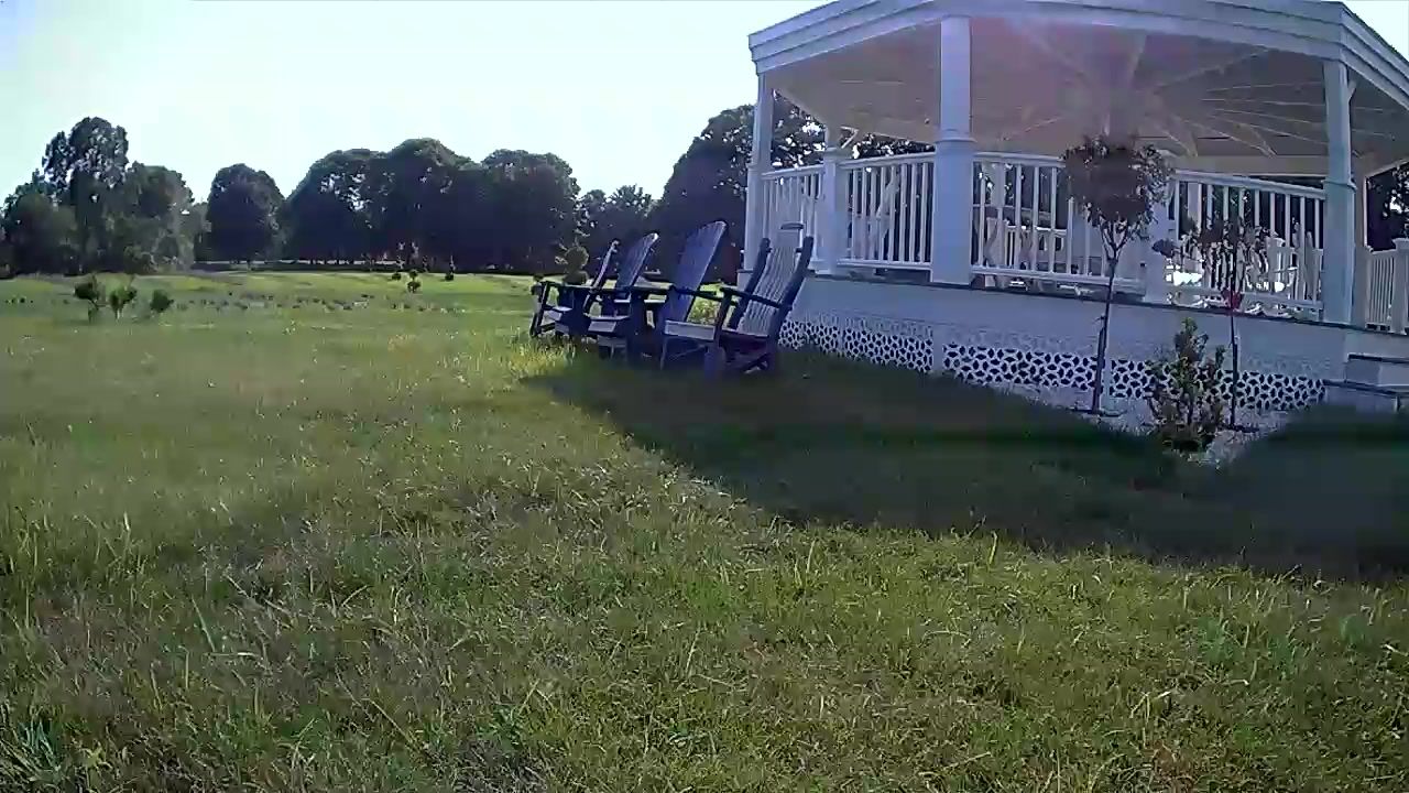 The gazebo and lawn chairs on a summer day