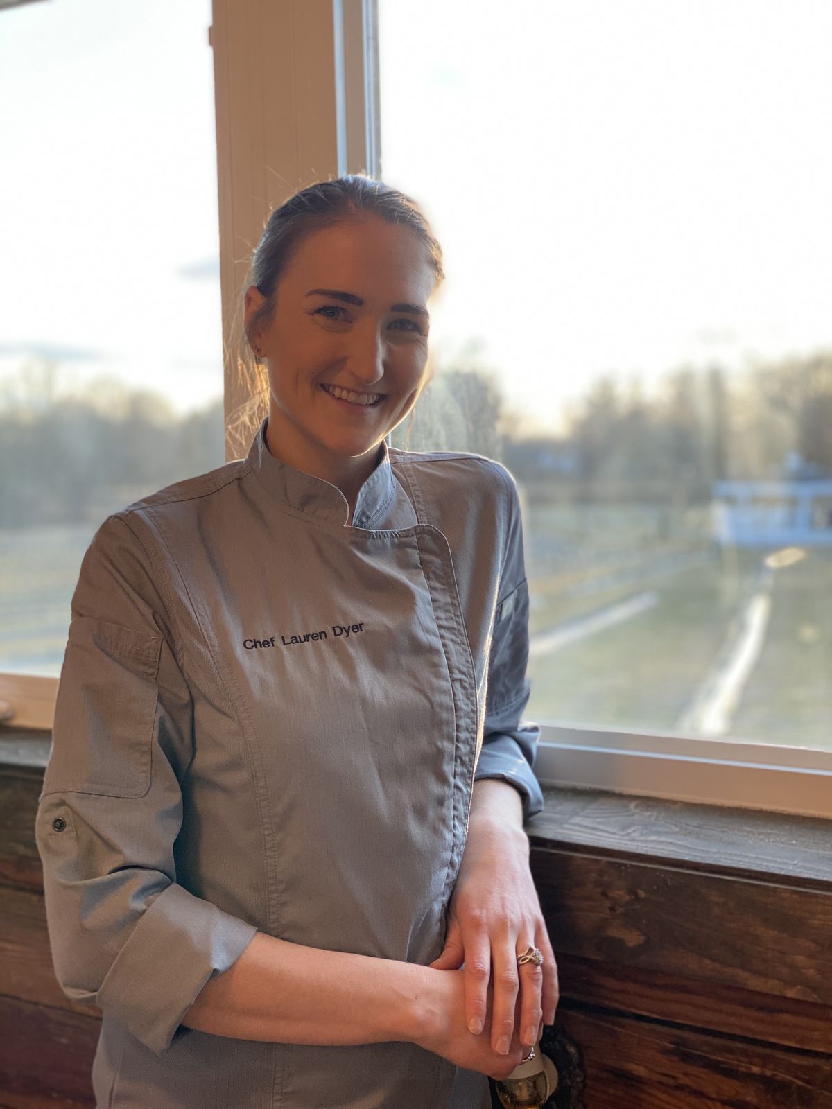 Chef Lauren Dyer by the suite window