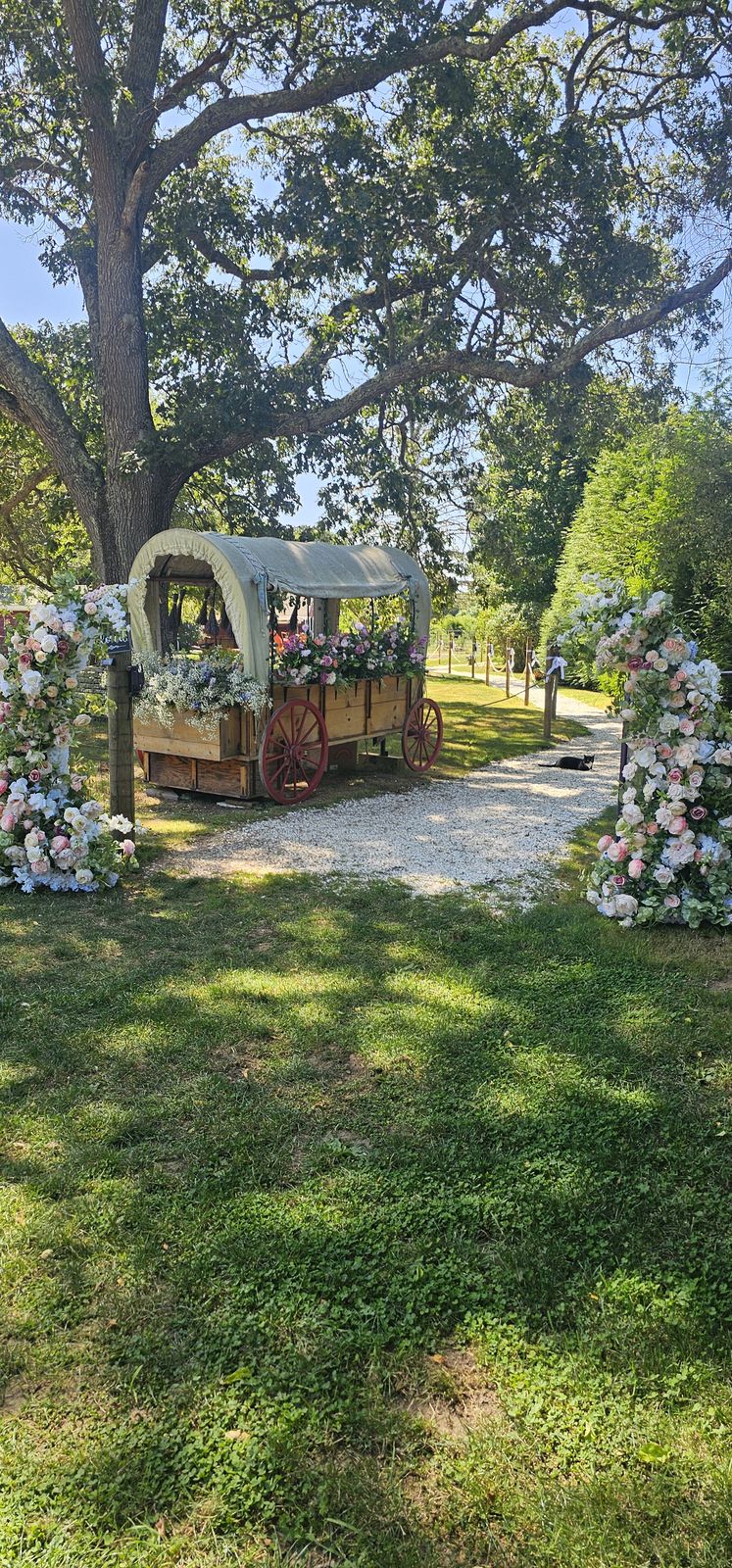 The farm's covered wagon dressed with flowers