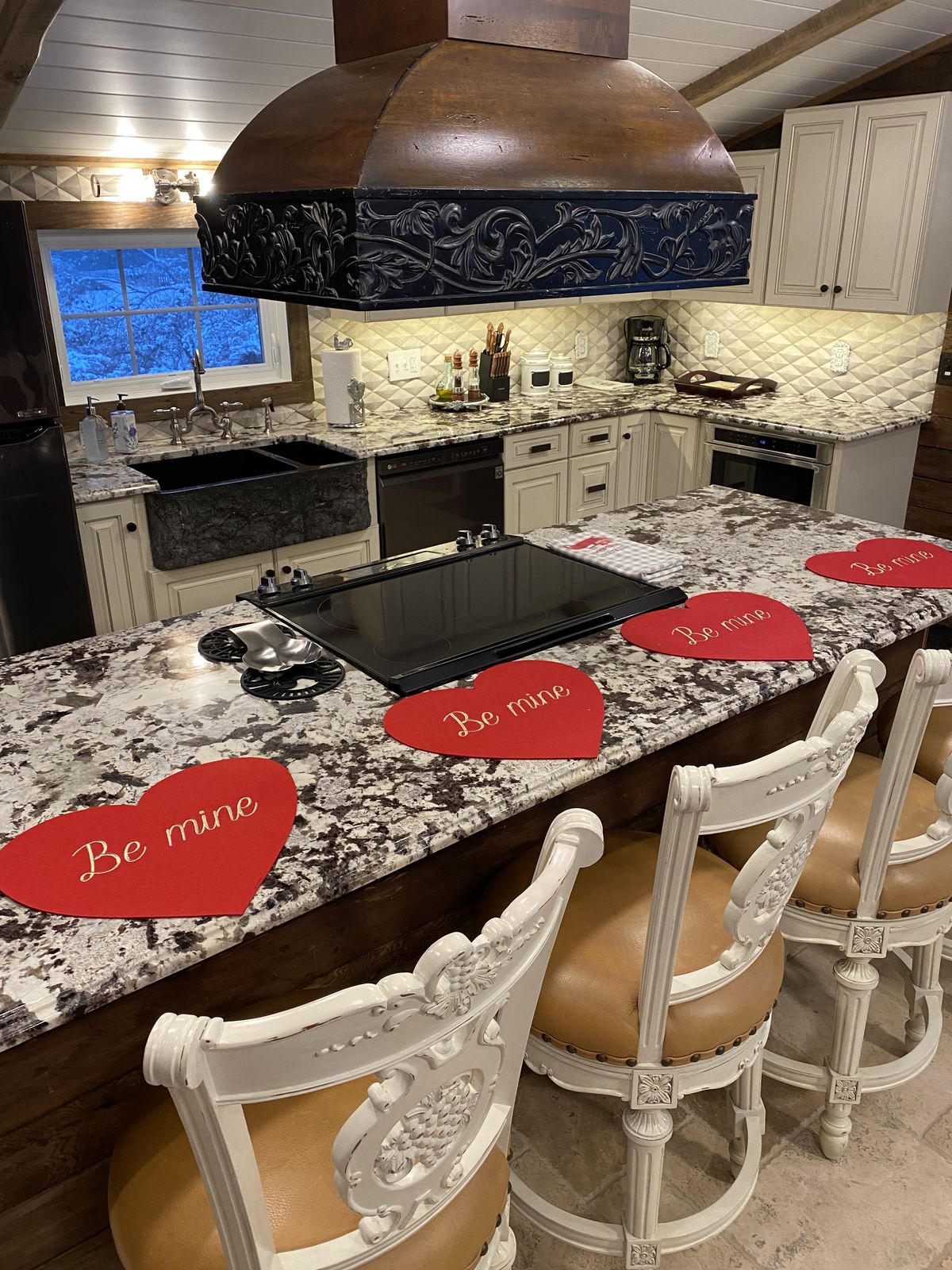 The suite's dining island set for a private dinner